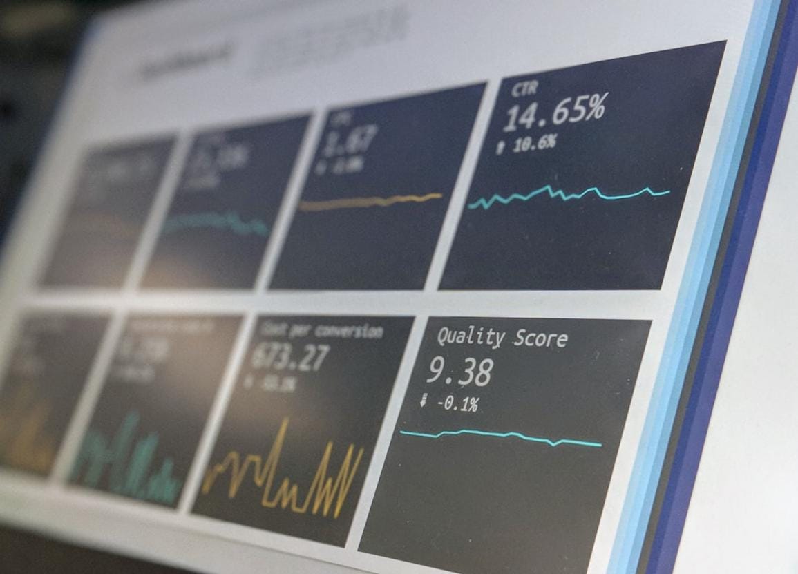 A professional investor reviewing detailed company reports and stock holdings on digital tablets.